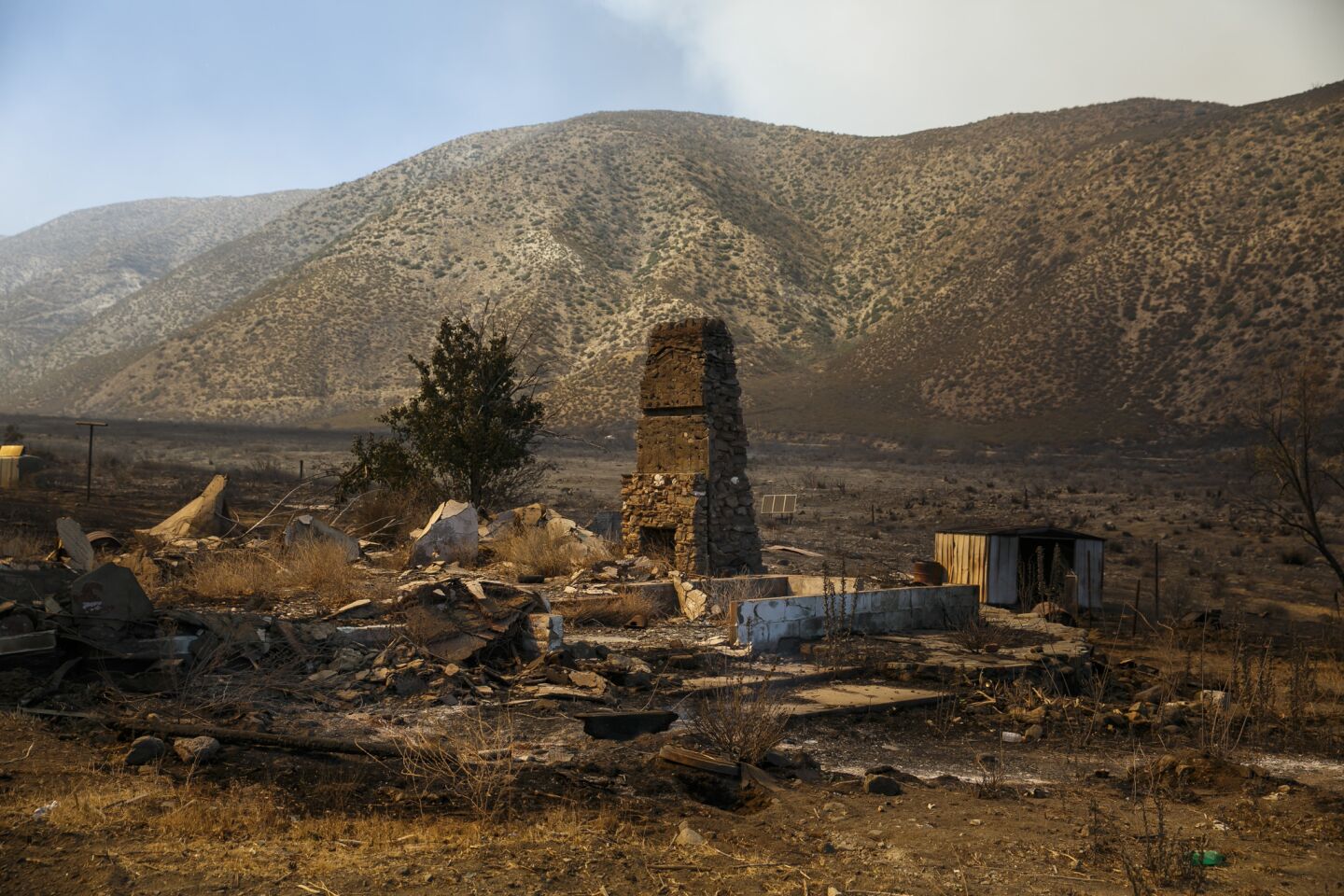 An abandoned structure sits in the path of the Blue Cut fire after it has passed through Lone Pine Canyon in San Bernardino County.