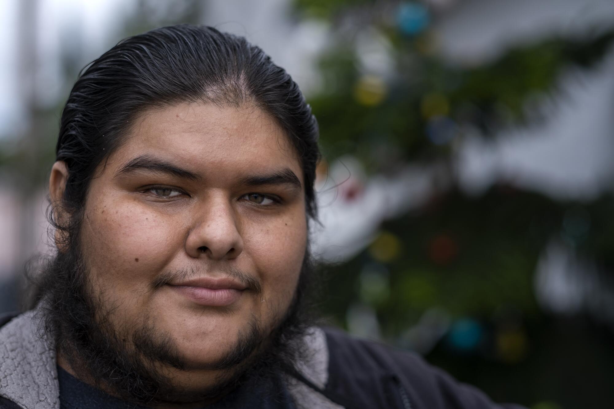 Sergio Nuo, 25, outside his family home in Compton.