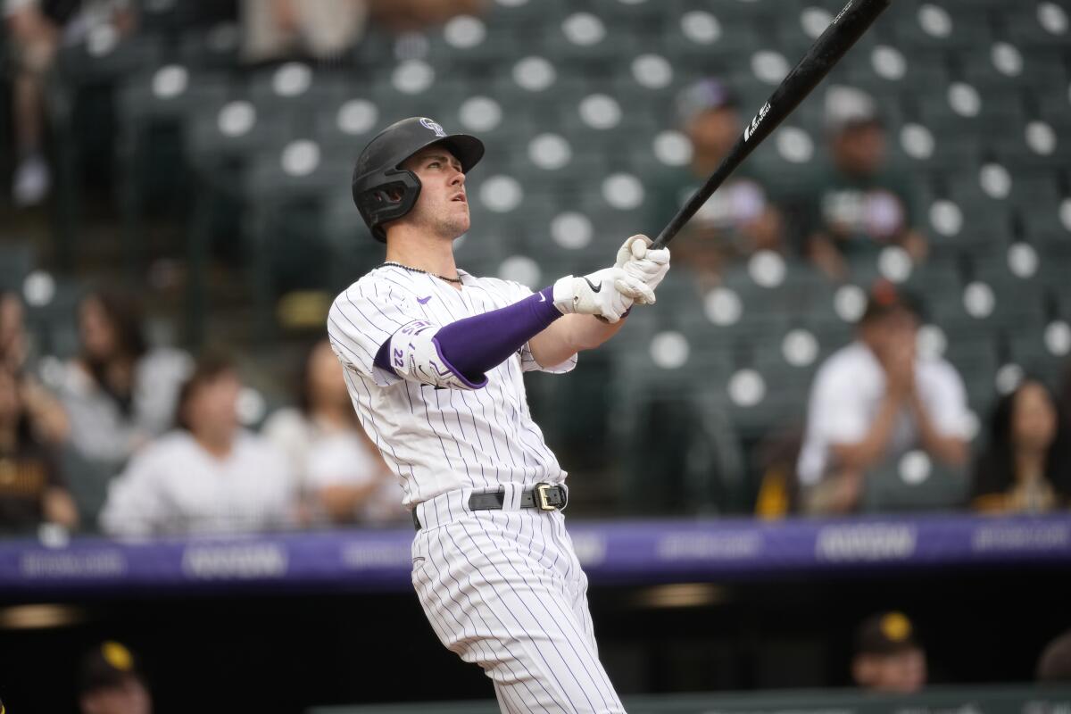Rockies fall behind early, score 5 in 9th to beat Rangers