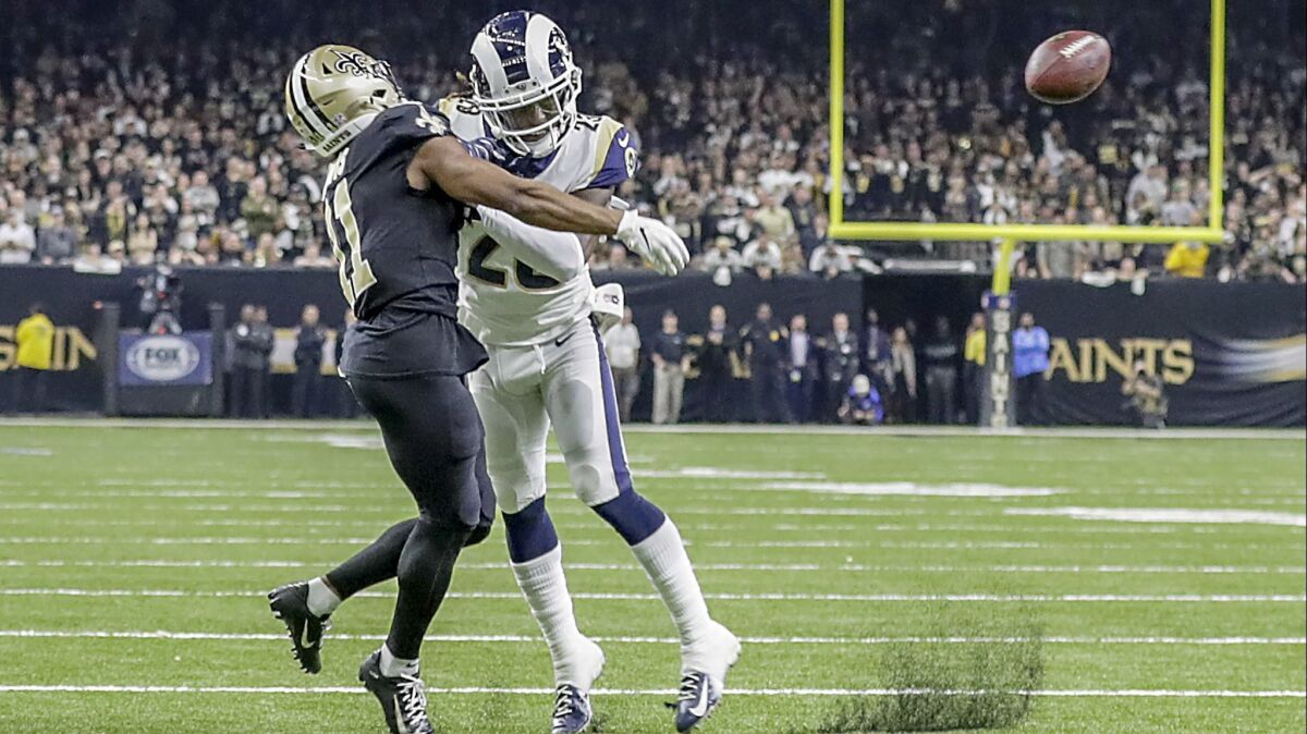 Rams cornerback Nickell Robey-Coleman seems to deliver an early hit to Saints receiver Tommylee Lewis late in the fourth quarter, thwarting a potential game-clinching drive in the NFC championship game in New Orleans.