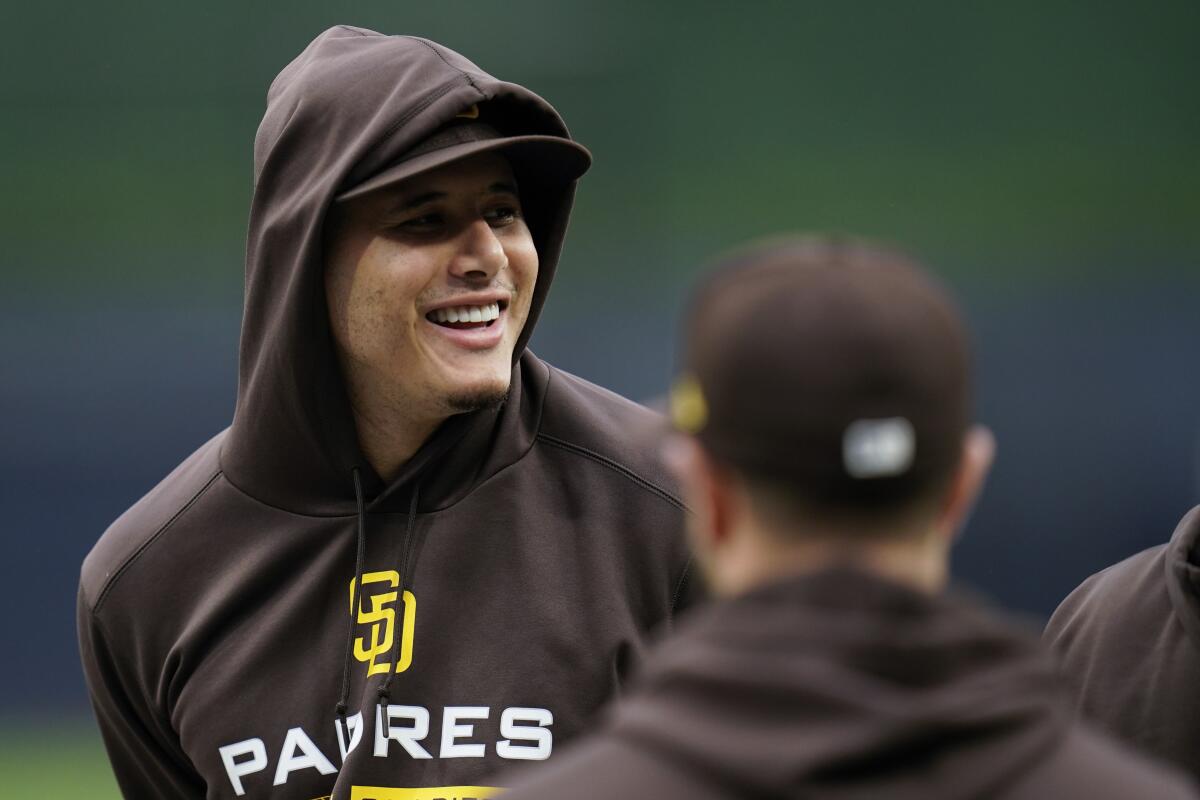 San Diego Padres third baseman Manny Machado watches during the baseball team's workout Thursday, Oct. 13, 2022, in San Diego. The Padres host the Los Angeles Dodgers in Game 3 of an NL Division Series on Friday. (AP Photo/Gregory Bull)