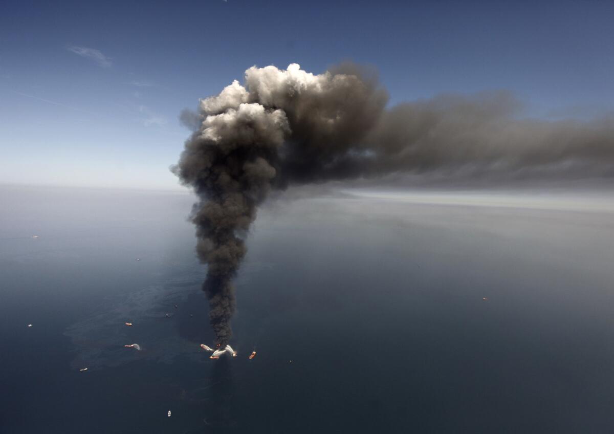 Smoke rises from the crippled Deepwater Horizon oil rig April 21, 2010.