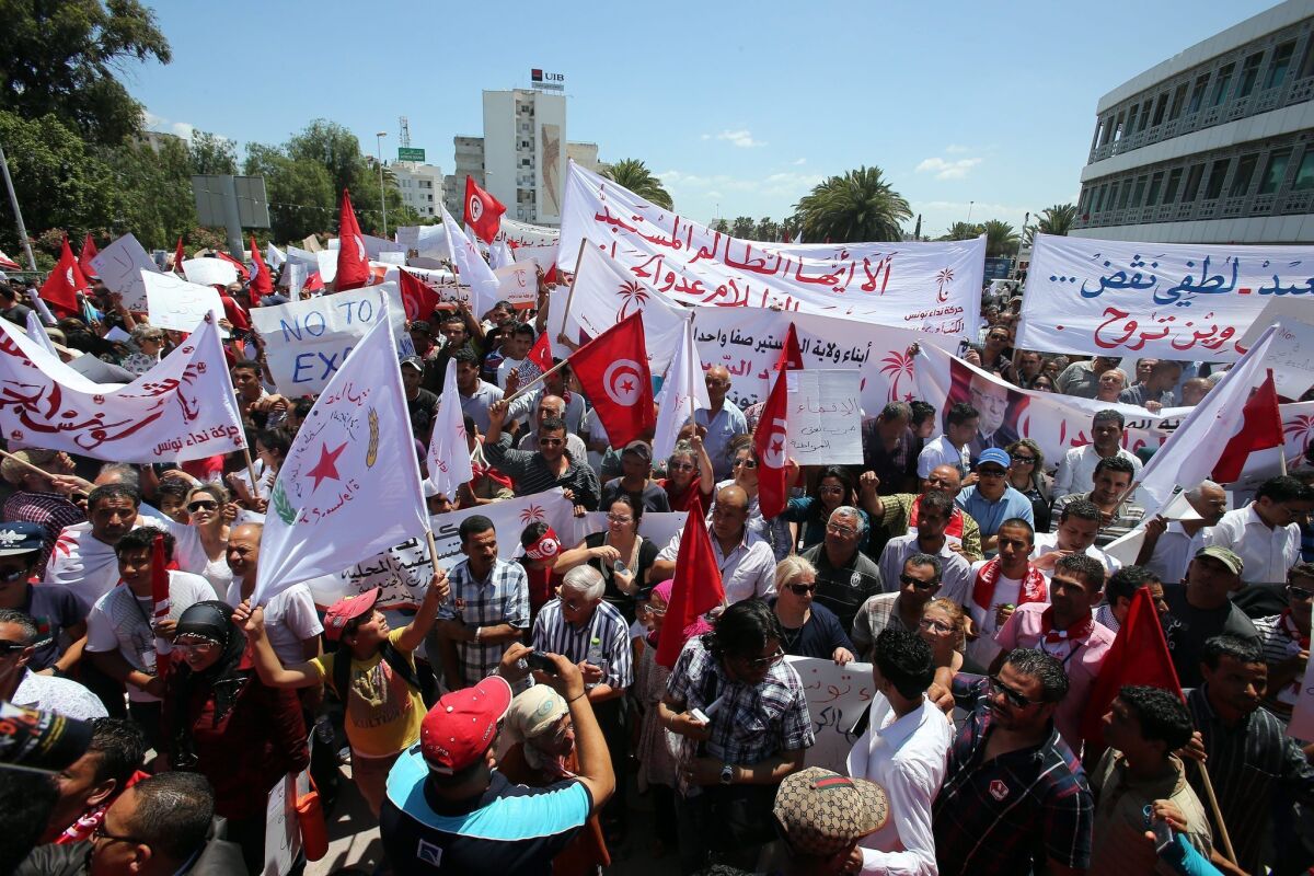 Supporters of a new secular-based political party in Tunisia called Nidaa Tounes, or "Call of Tunisia," take part in a protest against the ruling Islamist party, Nahda. Polls show Nidaa Tounes is gaining in popularity and could win elections that most expect to occur in early 2014.