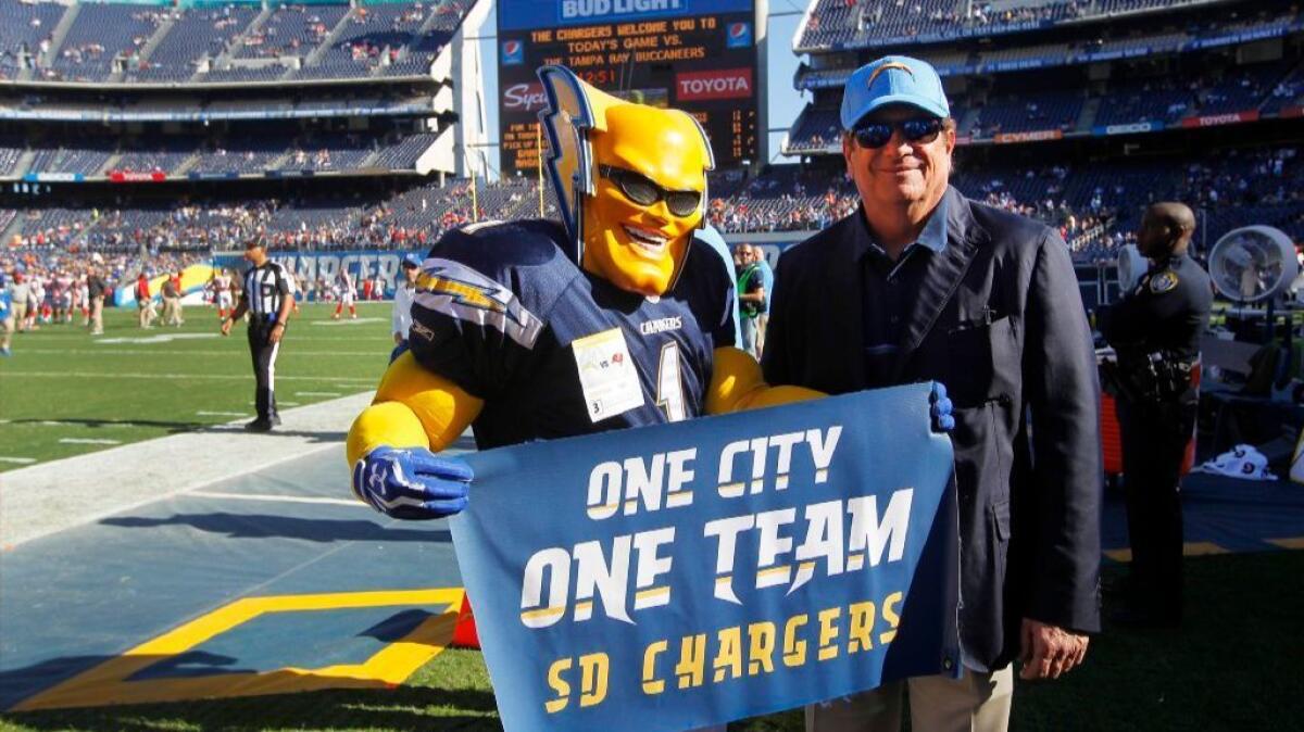 Chargers owner Dean Spanos takes a photo with Boltman before a game against the Buccaneers in San Diego on Dec. 4.