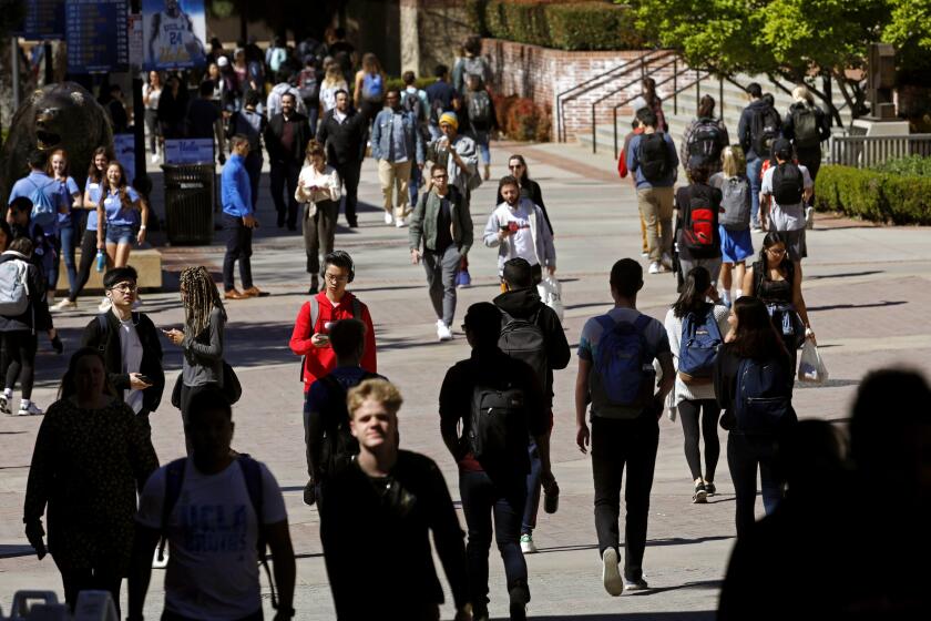 LOS ANGELES, CA - MARCH 13, 2019 ó UCLA students make their way through the UCLA campus a day after the college bribery scandal in Los Angeles on March 13, 2019. A UCLA men's soccer coach was put on leave for being involved. (Genaro Molina/Los Angeles Times)