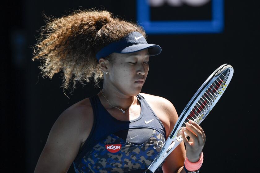 Japan's Naomi Osaka during her semifinal against United States' Serena Williams at the Australian Open Tennis championships in Melbourne, Australia, Thursday, Feb. 18, 2021. (AP Photo/Andy Brownbill)