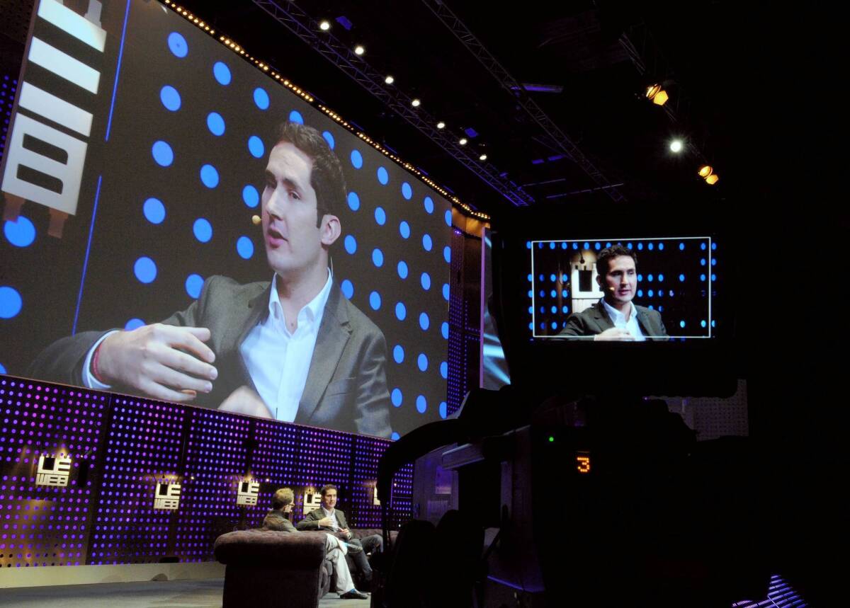 Instagram founder Kevin Systrom, seen above at a technology conference in France this month, tried to calm the uproar caused by the firm's new terms of service. “Instagram does not claim any ownership rights over your photos,” he wrote in a blog post Tuesday afternoon. “We respect that your photos are your photos. Period.”