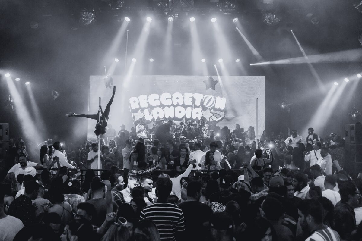 black and white photo of a crowded club