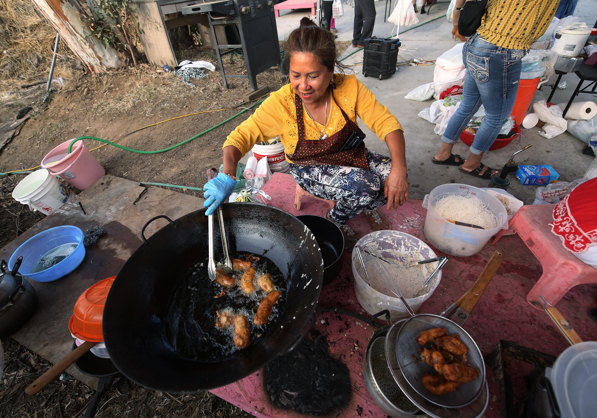 Be Ban fries up some bananas at the Cambodian Night Market in Fresno.