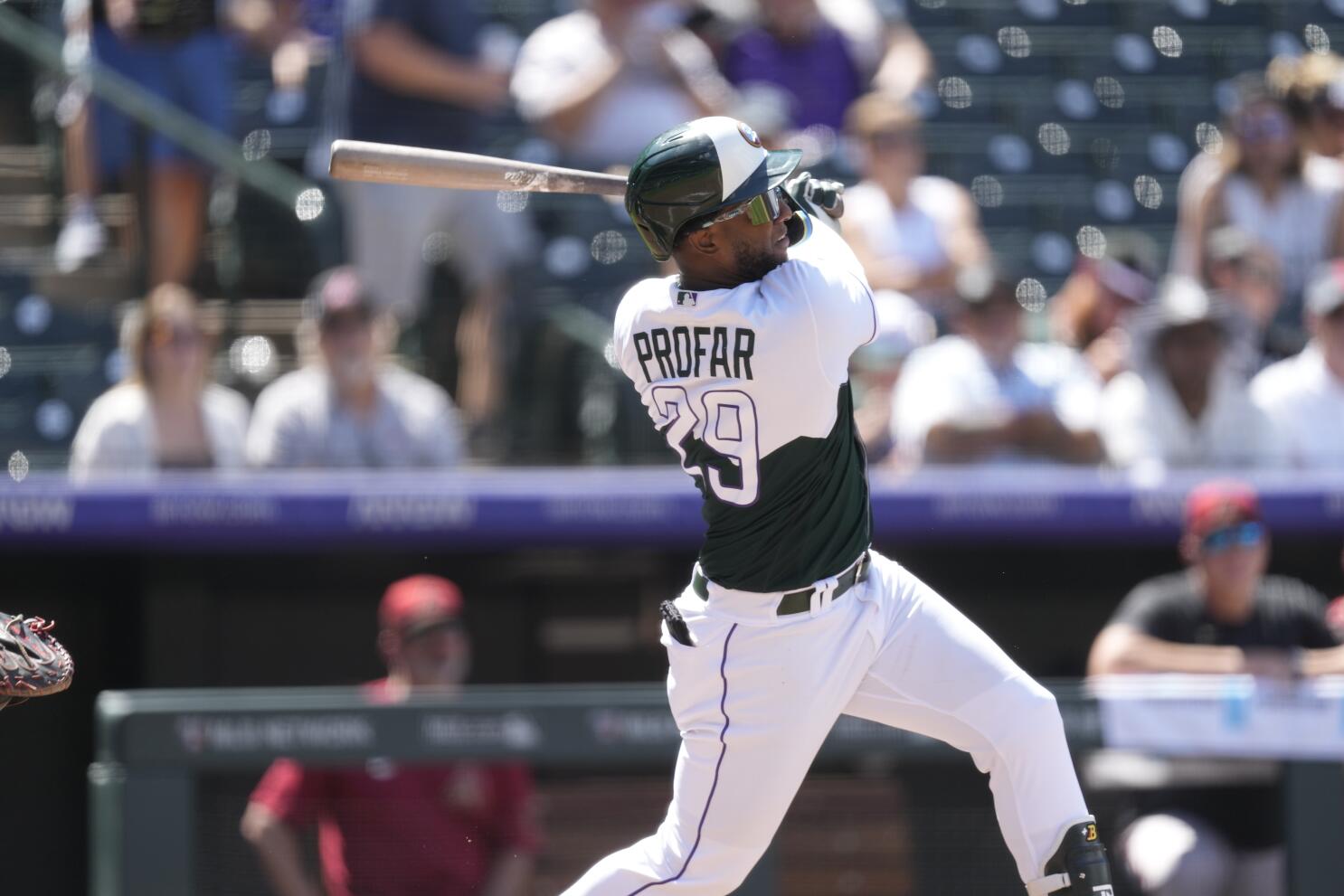 Jurickson Profar of the Colorado Rockies walks off the field