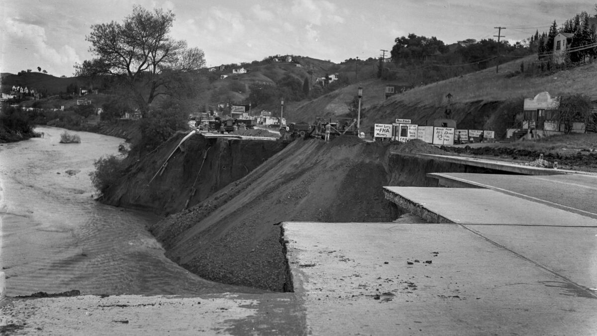 March 7, 1938: Workers fill in a 300-yard section of Ventura Boulevard near Laurel Canyon Drive that was gouged out by the Los Angeles River.