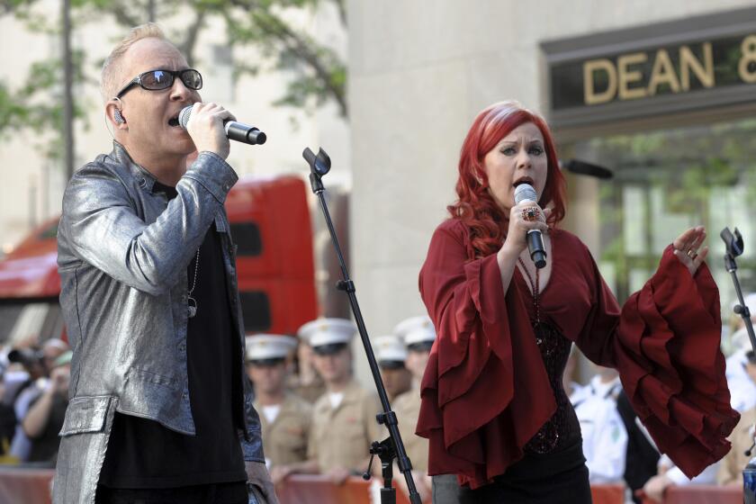 FILE - Singers Fred Schneider and Kate Pierson of the music group "The B-52s" perform on NBC's "Today Show" in Rockefeller Plaza on Monday, May 26, 2008, in New York. The Athens Rock Lobsters, a minor-league hockey team that will begin play next season in the home of the University of Georgia paid homage to the city’s rich musical heritage by choosing a nickname associated with one of its most famous bands. The B-52s released their quirky, crustacean-themed song “Rock Lobster” in the late 1970s. (AP Photo/Peter Kramer, File)
