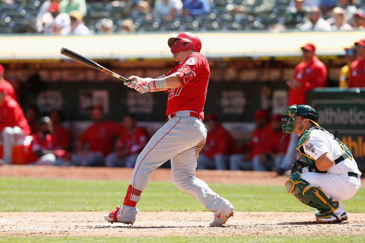 Angels' Mike Trout hits a two-run home run in the top of the third inning against the Oakland Athletics on Thursday in Oakland.