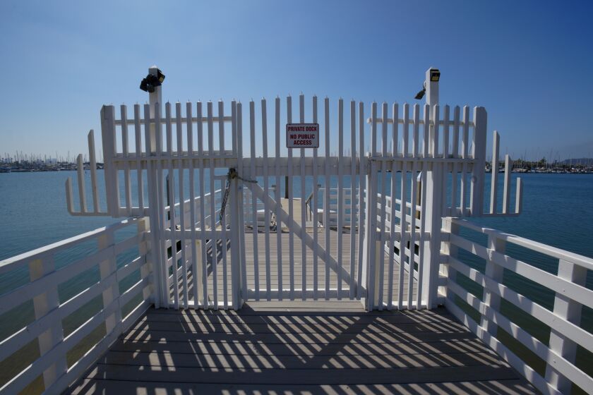 At the foot of Bessemer Street in Point Loma is the Donnelley Pier. About half down the pier is gate that locks the public out from accessing the private dock.