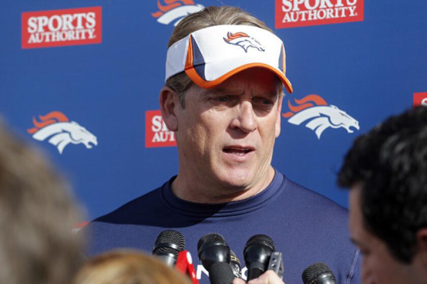Denver Broncos defensive coordinator Jack Del Rio speaks with reporters after a team practice session on Jan. 16. Del Rio's role with the Broncos complicated his chance of becoming USC's football coach.