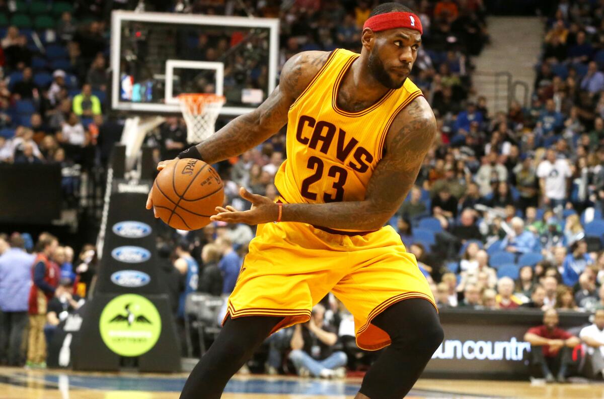 Cleveland's LeBron James handles the ball during a 106-90 victory over the Minnesota Timberwolves in Minneapolis on Jan. 31.