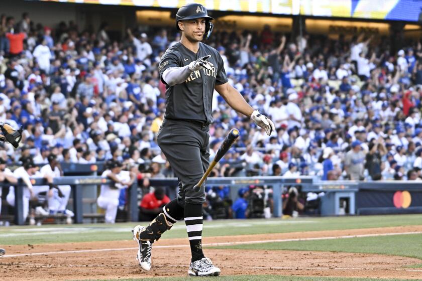 LOS ANGELES, CA - JULY 19: American League outfielder Giancarlo Stanton, of the New York Yankees, tosses his bat after a home run during the 2022 MLB All-Star Game at Dodger Stadium on Tuesday, July 19, 2022 in Los Angeles, CA. (Wally Skalij / Los Angeles Times)