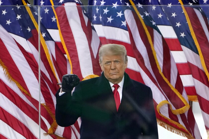 Then-President Trump gestures as he arrives to speak at a rally in Washington in January.