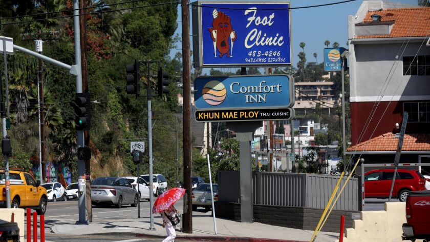 Sunset Foot Clinic has been known for its revolving sign on Sunset Boulevard that shows a cartoonish "happy foot" on one side and a "sad foot" on the other. The clinic is moving and the sign will disappear.