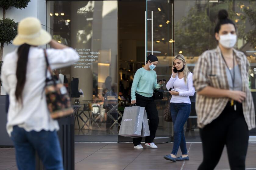 LOS ANGELES, CA - OCTOBER 21: Shoppers exit Nordstrom at The Grove on Thursday, Oct. 21, 2021 in Los Angeles, CA. Shoppers are enjoying the beautiful fall day. (Francine Orr / Los Angeles Times)