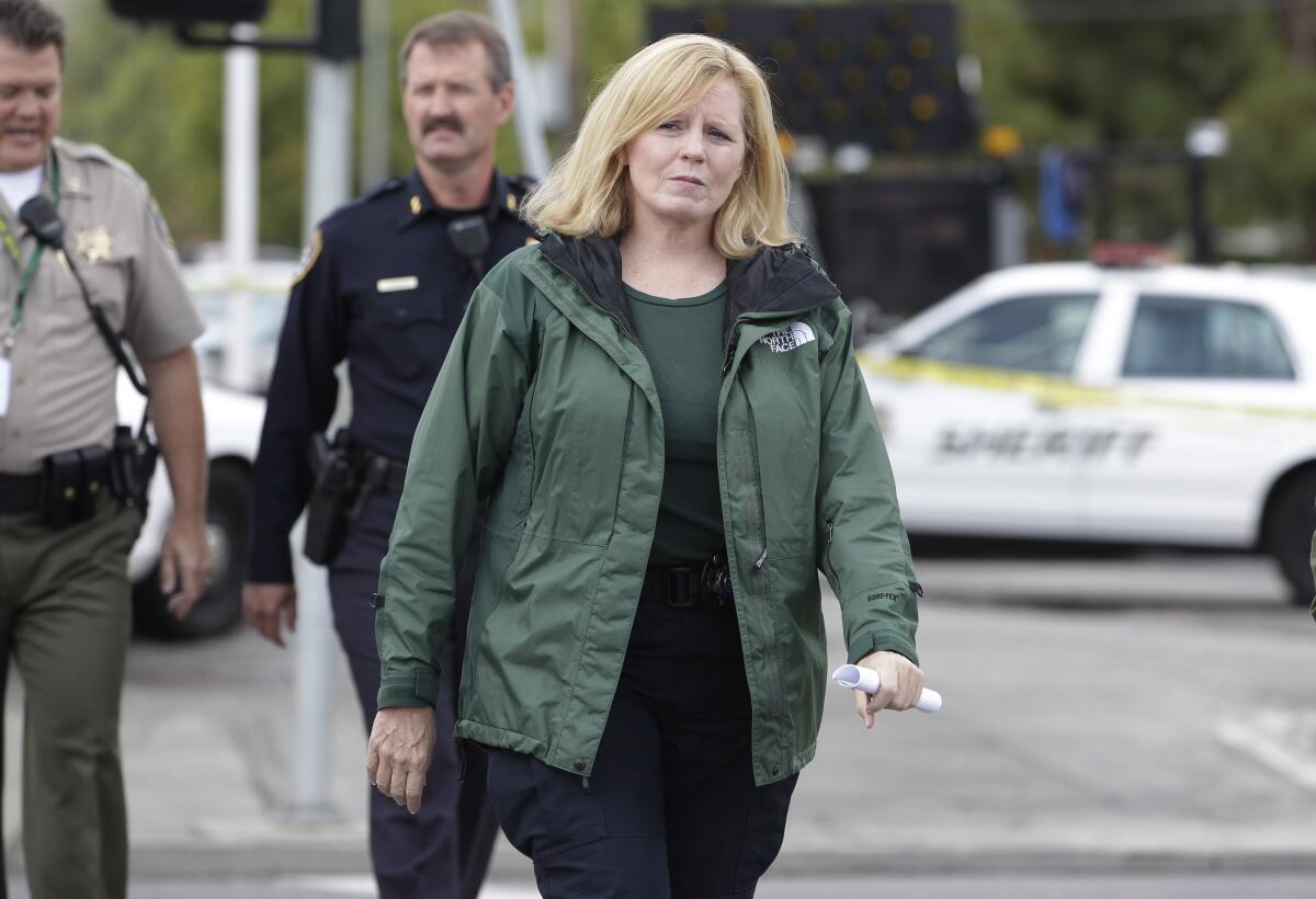Santa Clara County Sheriff Laurie Smith walks to a news conference