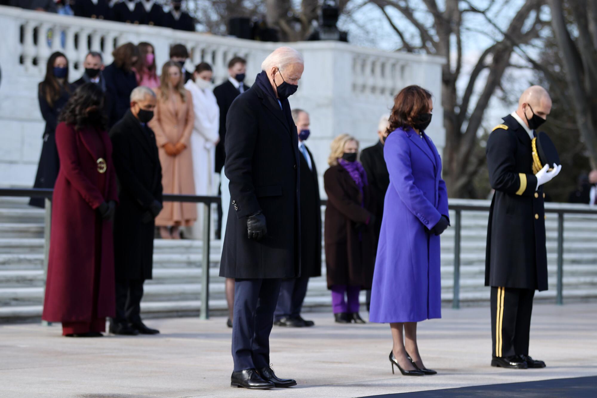 President Biden and Vice President Kamala Harris attend a wreath-laying ceremony at Arlington National Cemetery.
