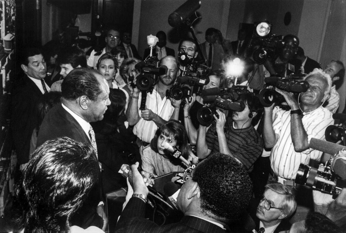 April 5, 1991: Mayor Tom Bradley is confronted by the media after leaving City Hall chambers prior to a Los Angeles City Council closed session.
