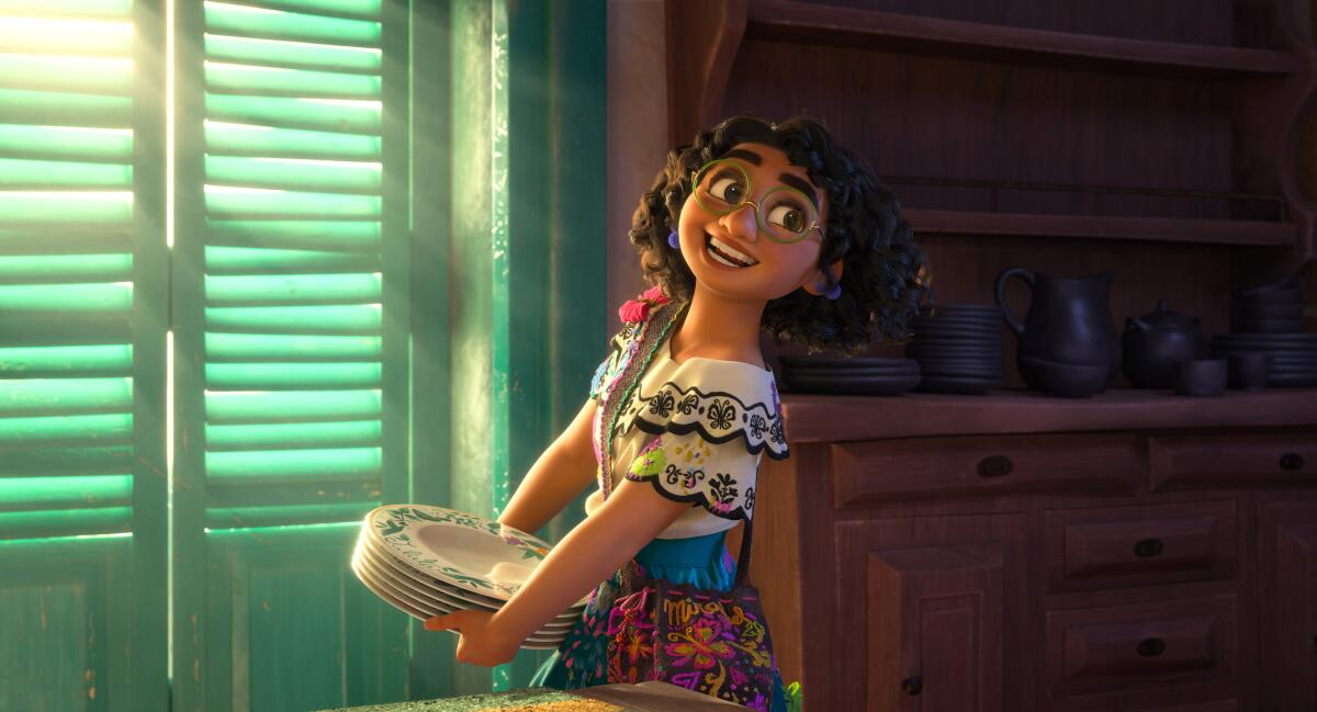 A girl carrying a stack of plates in the animated movie 'Encanto.'