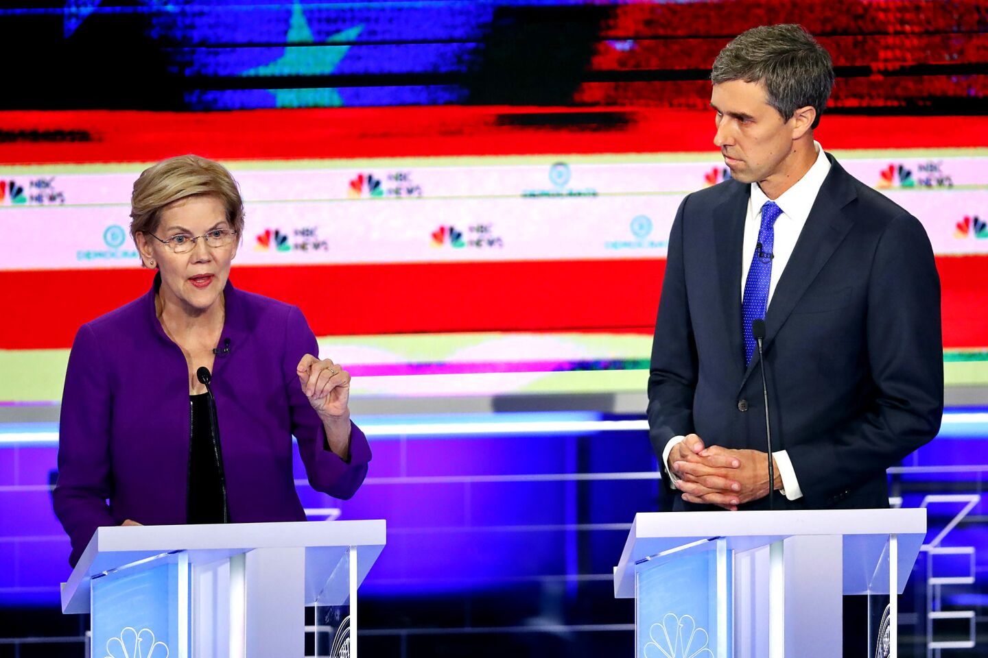 Democratic presidential candidate Sen. Elizabeth Warren, D-Mass., answers a question, as former Texas Rep. Beto O'Rourke listens during a Democratic primary debate hosted by NBC News at the Adrienne Arsht Center for the Performing Art, Wednesday, June 26, 2019, in Miami.