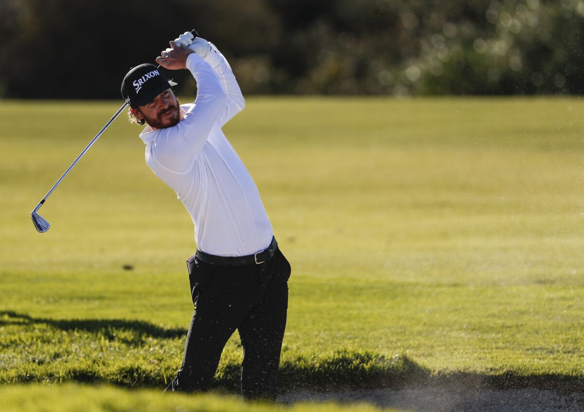 Sam Ryder hits from the bunker on the 17th hole during the second round of the Farmers Insurance Open in La Jolla.