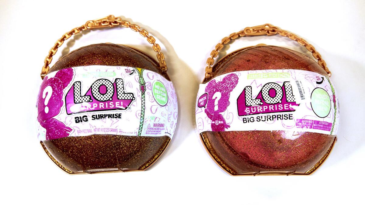 An authentic L.O.L. Surprise! Big Surprise made by MGA Entertainment, left, and a knockoff MGA alleges was sold by TomTop Technology Co. of Shenzhen, China.