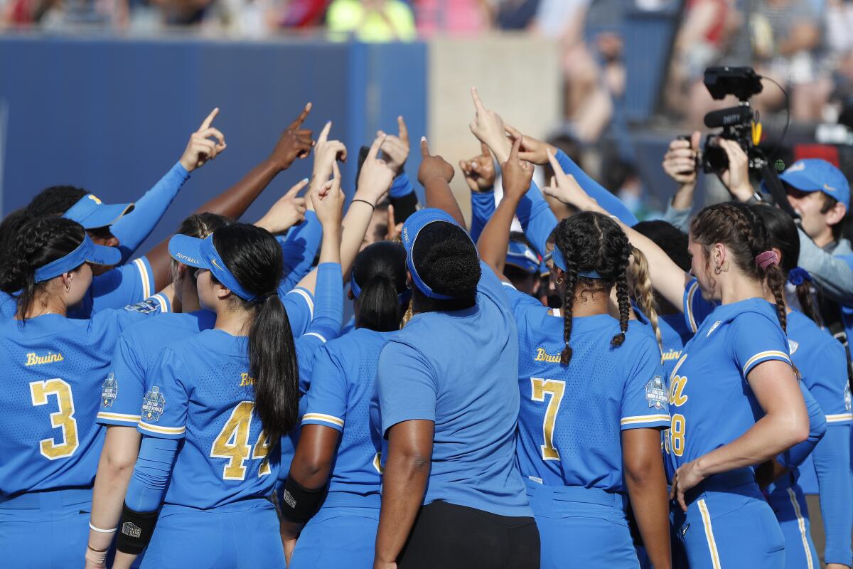 UCLA huddles before a Women's College World Series game against Northwestern on June 3 in Oklahoma City. 