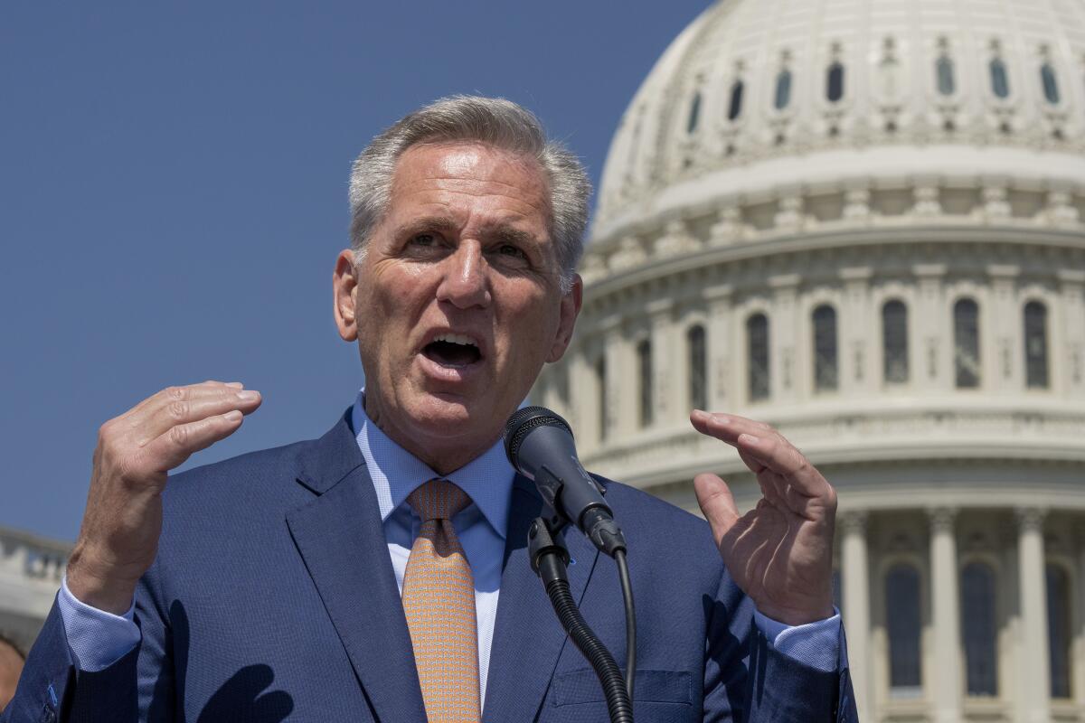 House Speaker Kevin McCarthy stands in front of the U.S. Capitol.