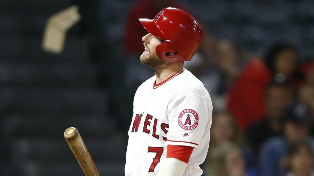 Angels’ Zack Cozart reacts to a called third strike during the seventh inning game against the Milwaukee Brewers at Angel Stadium on April 9.