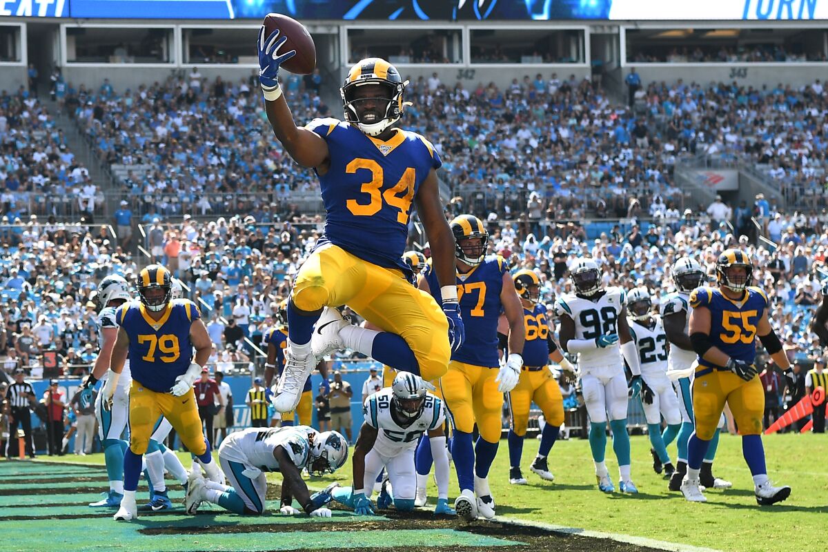 Rams running back Malcolm Brown celebrates his second touchdown against Carolina.