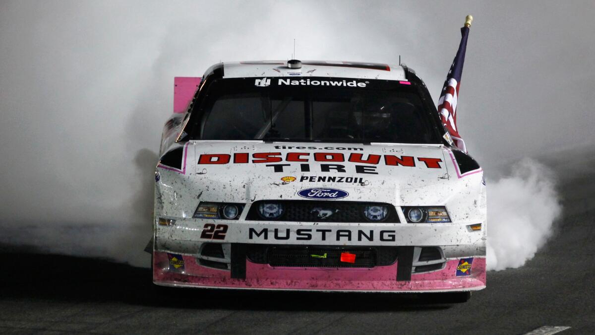 Brad Keselowski celebrates after winning a NASCAR Nationwide Series race at Charlotte Motor Speedway on Friday night.