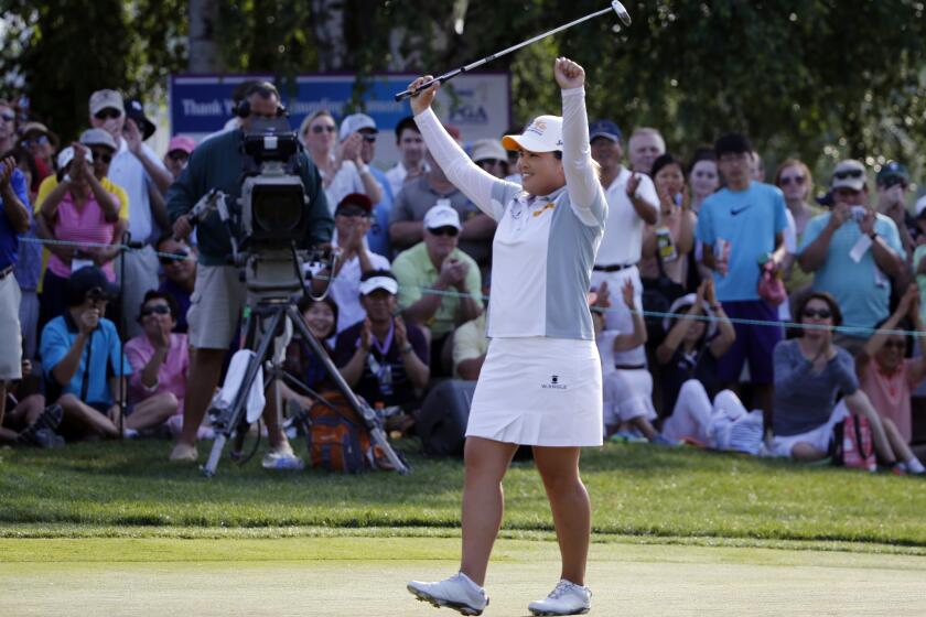 Inbee Park celebrates Sunday after winning the KPMG Women's PGA Championship for a third consecutive year.