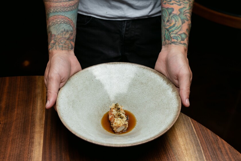 Chef-owner William Eick holds his Ebi (shrimp) dish at Matsu restaurant in Oceanside.
