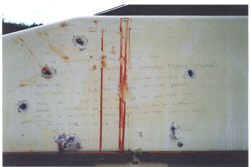 A prosecution exhibit shows Dzhokhar Tsarnaev's writings inside a boat where he hid during the Boston Marathon manhunt in April 2013.