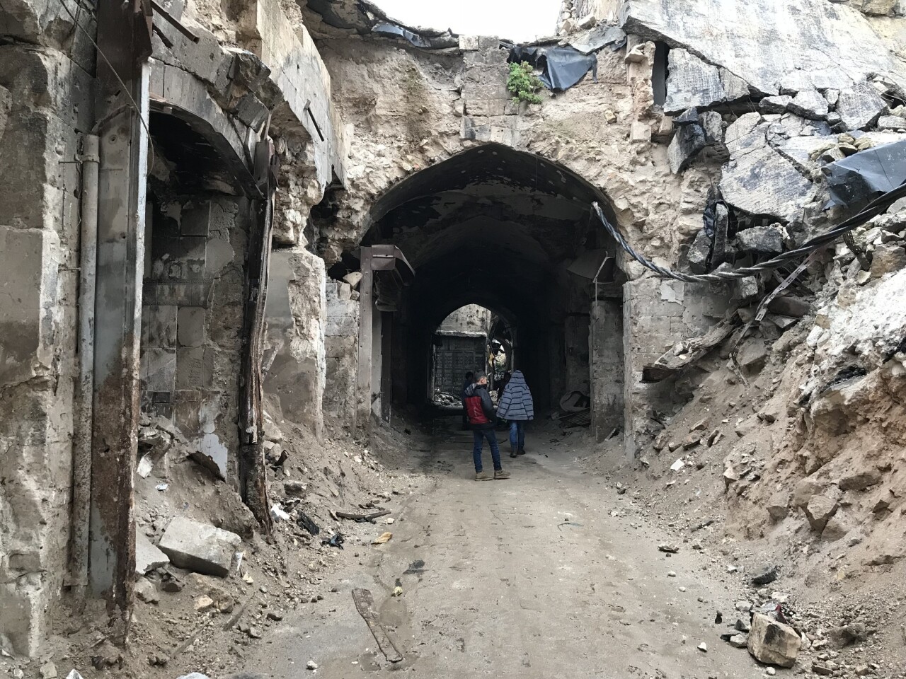 Children explore the ruins of the Old City of Aleppo.
