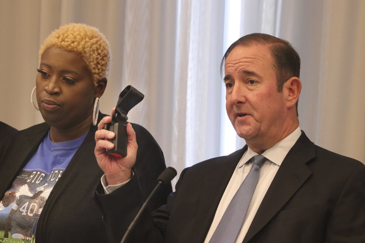 Michael Haggard, lawyer for Nekia Dodd, left, the mother of Tyre Sampson speaks at a news conference, Tuesday, April 26, 2022 in St. Louis. Dodd said her son's death has left her struggling with emotions ranging from frustration to grief to anger.(Hillary Levin/St. Louis Post-Dispatch via AP)
