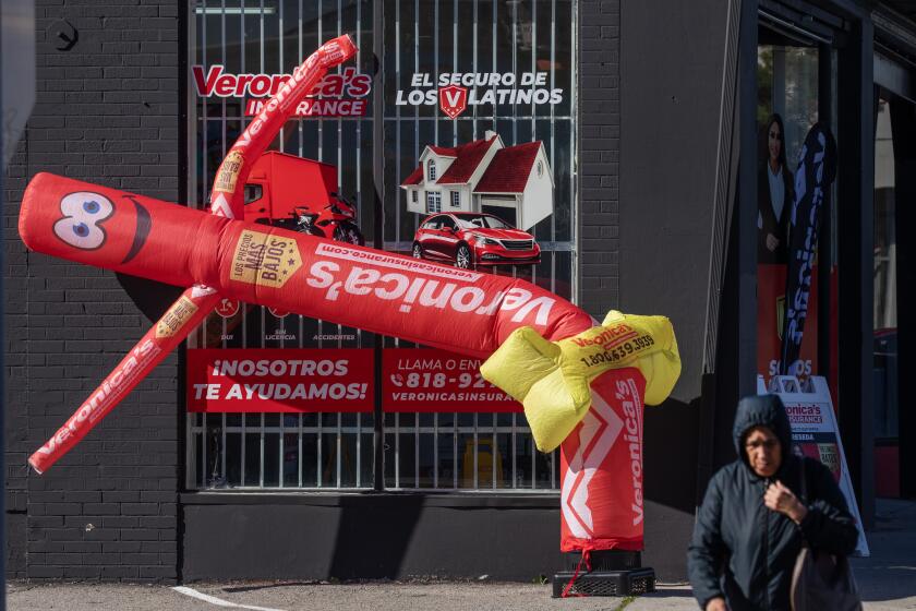 LOS ANGELES, CA - JANUARY 23: A wind dancer at an insurance company on Sherman Way in Reseda contorts during a wind advisory on Monday, Jan. 23, 2023 for parts of Los Angeles and Ventura Counties. (Myung J. Chun / Los Angeles Times)