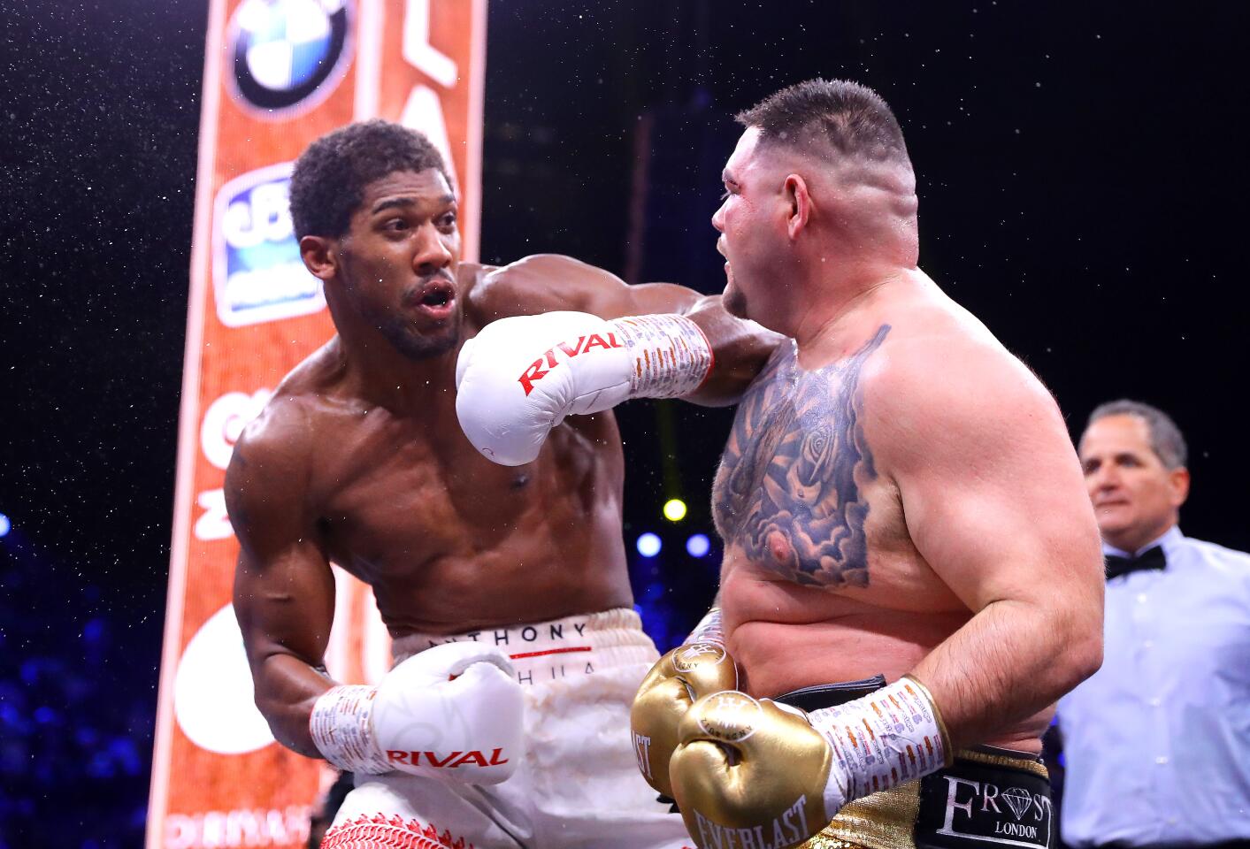 Andy Ruiz Jr. and Anthony Joshua exchange punches during a heavyweight title fight on Dec. 7 in Diriyah, Saudi Arabia.