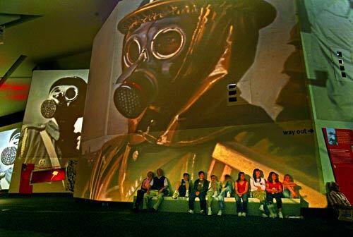 Visitors take in the "Big Picture" audio-visual presentation at the Imperial War Museum North in Salford, which is a short train ride from Manchester's city center. The British museum, according to Times Staff Writer Scott Timberg, is a heavy but somehow entertaining experience, with none of the celebratory spirit that war sometimes evokes.