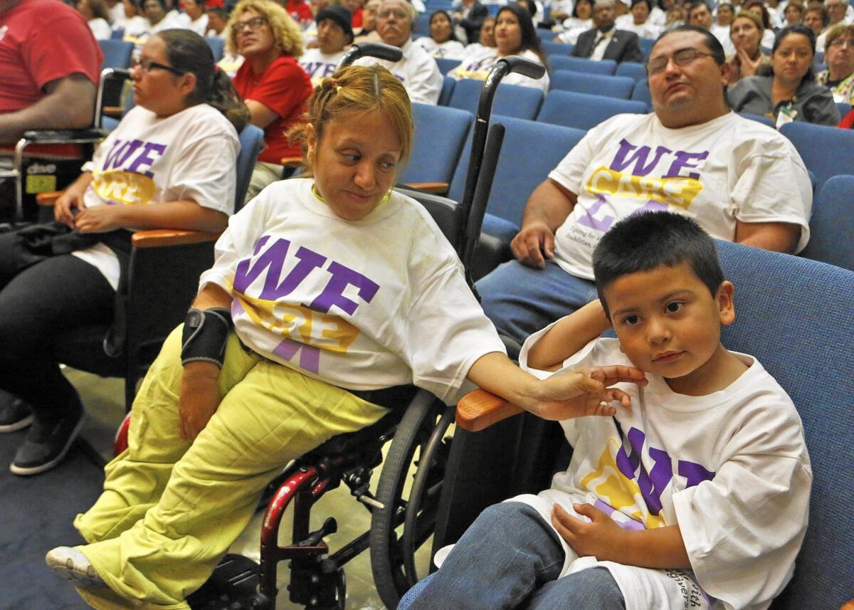 Attending the L.A. County supervisors meeting to support better wages for in-home care workers are Elizabeth Arvizu, center, her son Juan Pablo Lopez, right, husband, Jose Lopez, rear right and daughter Dulce Lopez.