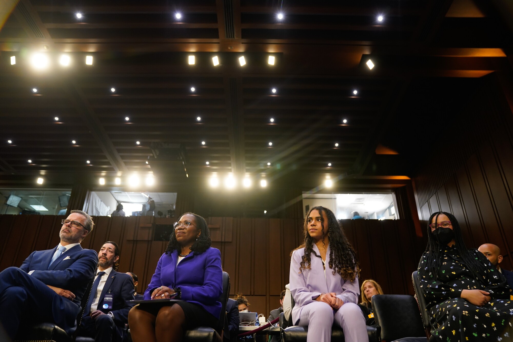 Supreme Court nominee Judge Ketanji Brown Jackson sits with her family before her confirmation hearing on Monday. 