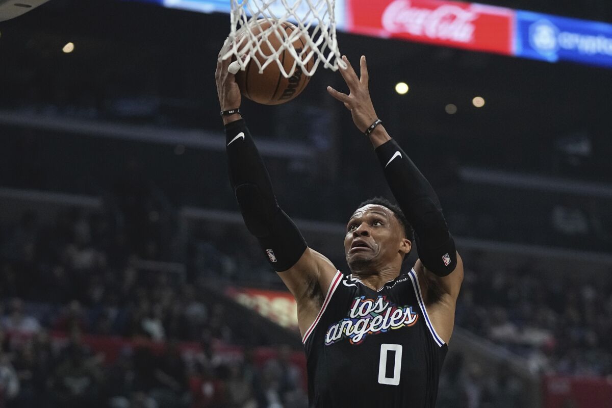 Clippers guard Russell Westbrook puts up a shot in the first half against the Sacramento Kings.