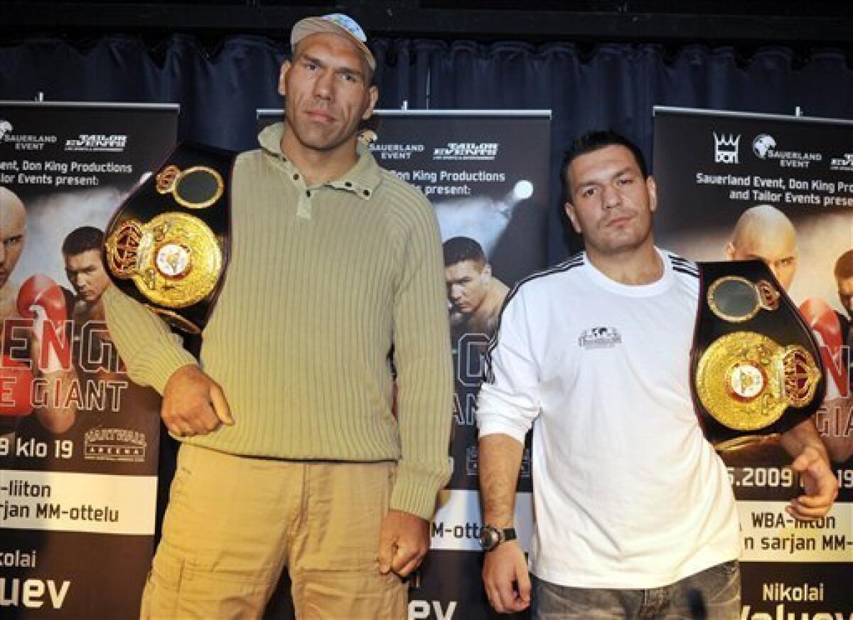 Russian heavyweight boxer and current holder of the World Boxing Association (WBA) title Nikolai Valuev, left, and Ruslan Chagaev of Uzbekistan pose during a press conference in Helsinki, Finland on Wednesday May 27, 2009. Valuev and Chagaev will fight each other in the title fight at the end of May in Helsinki.( AP Photo/LEHTIKUVA / Jussi Nukari