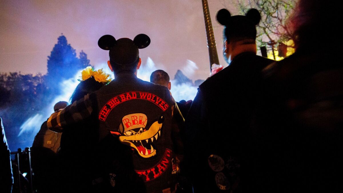 Members of the Big Bad Wolves social club watch the Fantasmic show at Disneyland on Jan. 21.