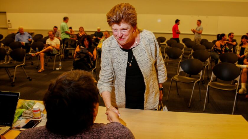 Former California state schools chief Delaine Eastin, a Democratic candidate for California governor, greets people as she arrives to speak at a meeting of the East Area Progressive Democrats in Los Angeles in June.
